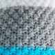 Knitted beanie POM turquoise/grey