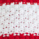 Knitted beanie POM LATVIA red