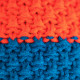 Knitted beanie POM orange/blue